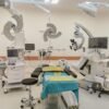 A state-of-the-art operating room fully equipped with advanced medical devices and surgical tools.