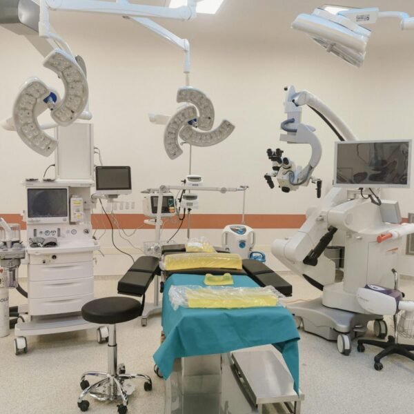 A state-of-the-art operating room fully equipped with advanced medical devices and surgical tools.