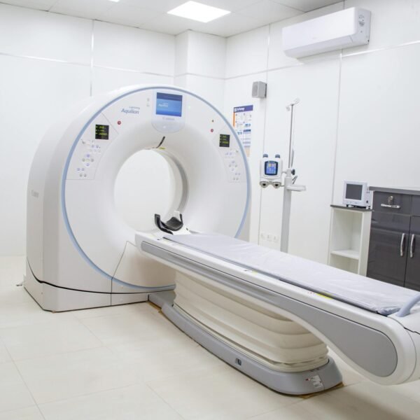 High-resolution image of a modern, clean MRI scanner room in a hospital facility.