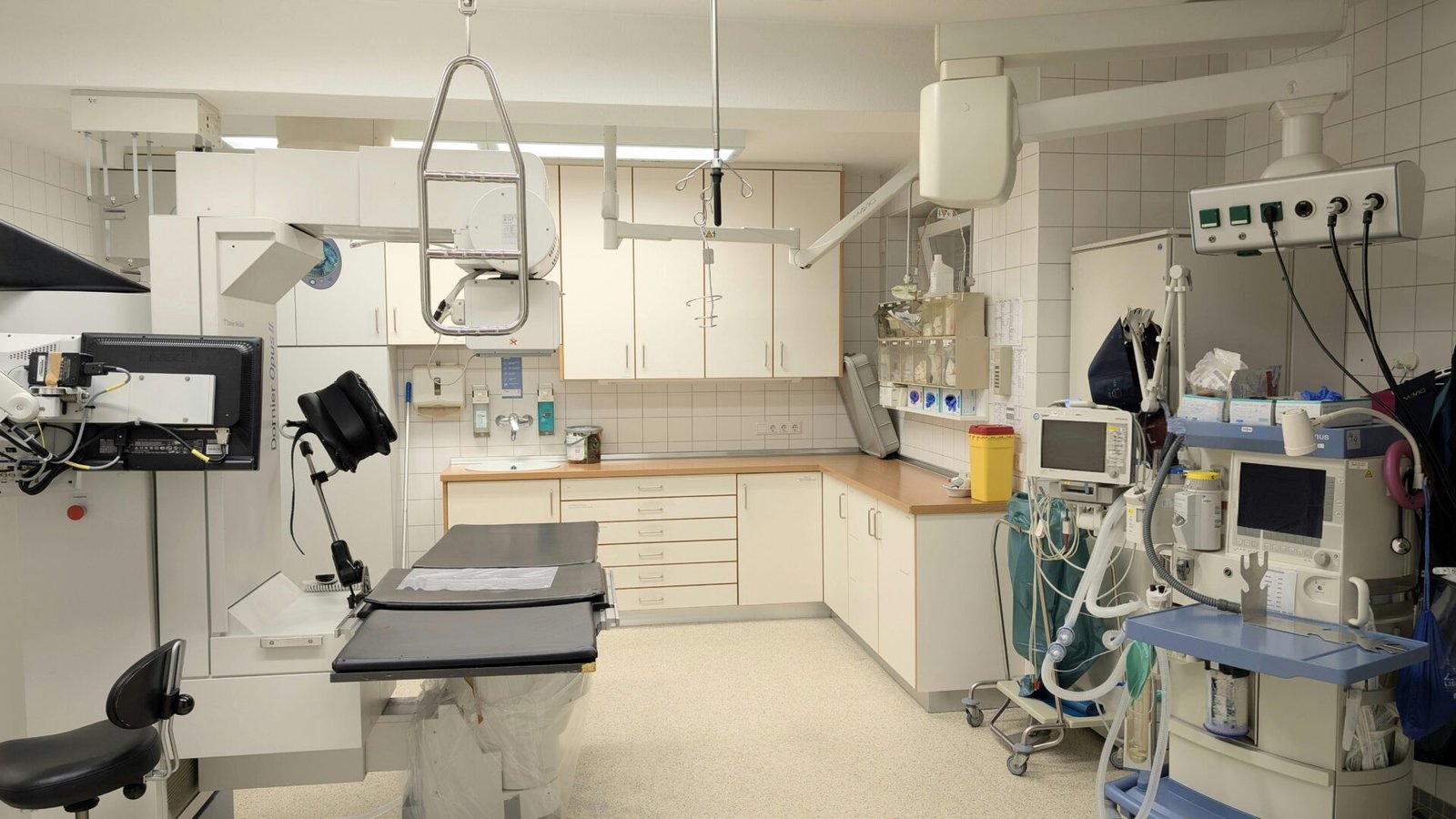 Spacious X-ray room equipped with advanced imaging technology in a hospital.