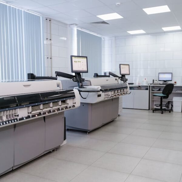 Spacious laboratory interior featuring state-of-the-art machines and computers for research purposes.